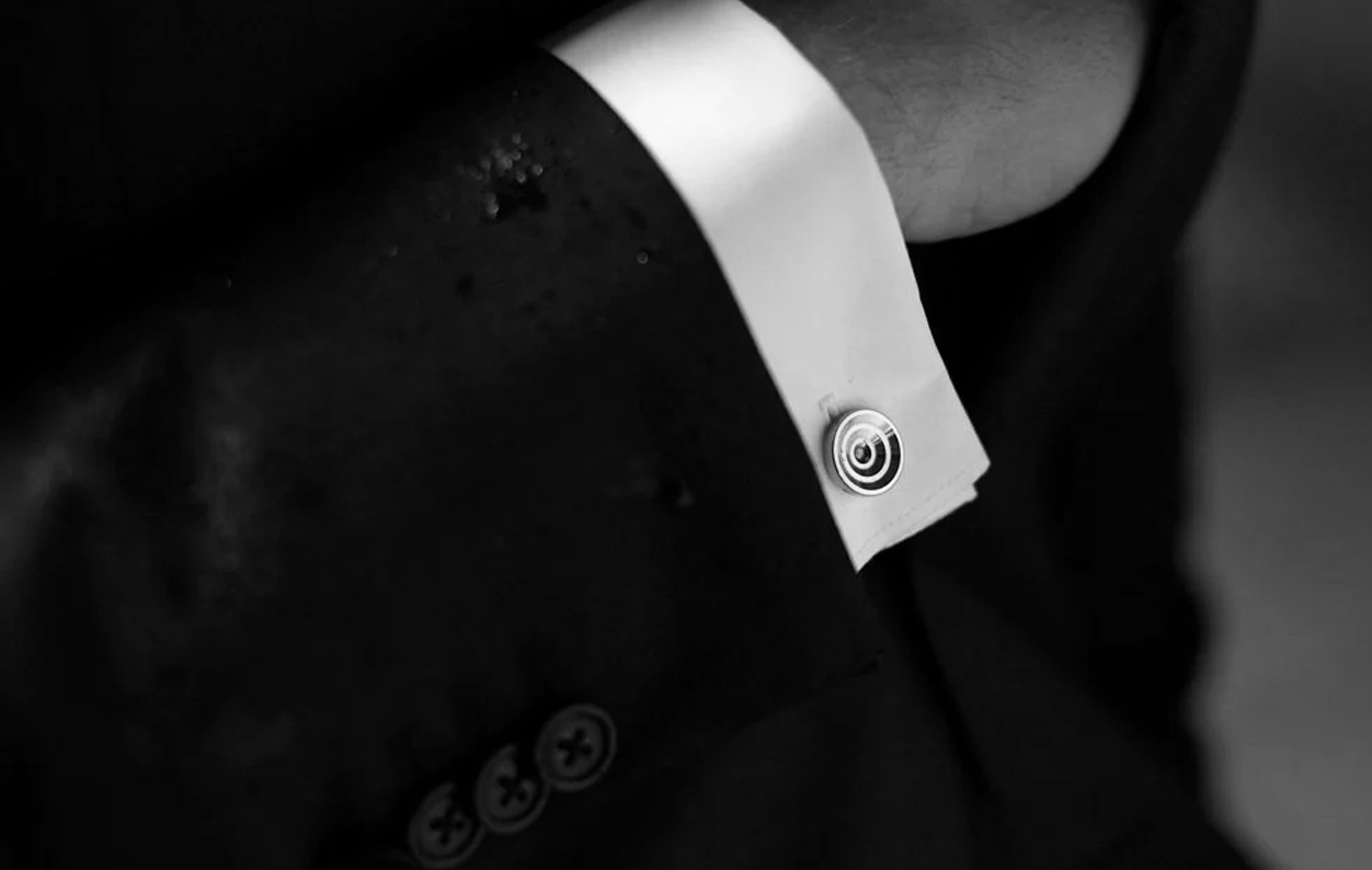 A close-up of elegant cufflinks accessorized for a formal event.